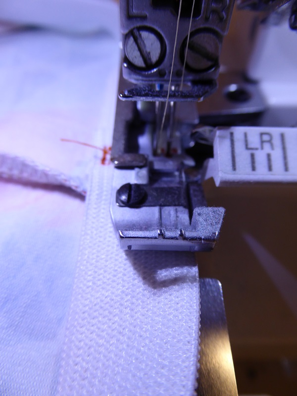 unravel_serger_threads_so_that_elastic_can_be_put_in_place_needles_down.jpg